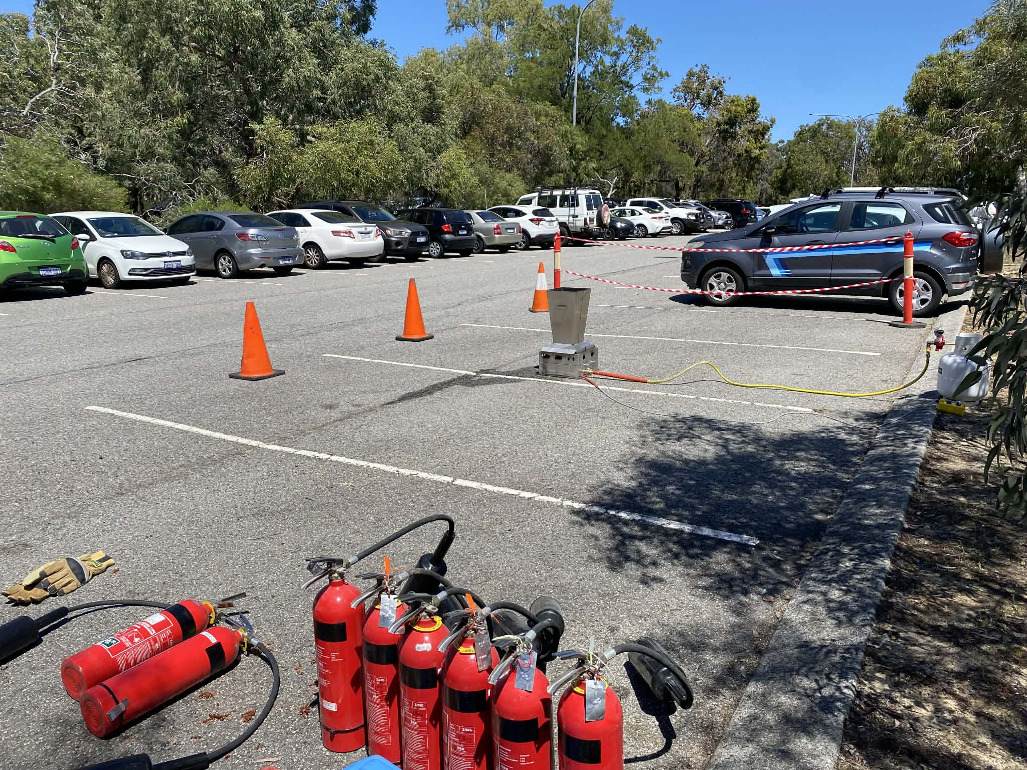 Professional fire training setup with safety barriers and equipment